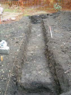 Trench after removal of topsoil showing feature 002, photograph from an archaeological excavation at Acheson House, Canongate, Edinburgh