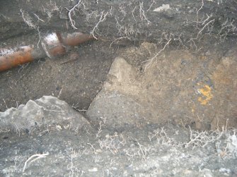 Wall, showing midden to east, photograph from an archaeological excavation at Acheson House, Canongate, Edinburgh
