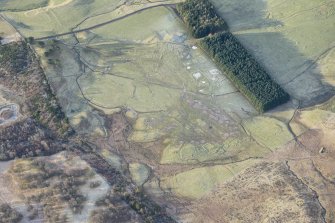 Oblique aerial view of the hut circles, townships, farmsteads, field boundaries and rig at Craig Dubh-Leitir, looking W.