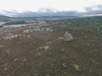 Oblique aerial view of hut circles A and B, looking NE.