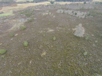 Oblique aerial view of hut circles A and B, looking NE.