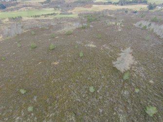 Oblique aerial view of hut circles A and B, looking NE.