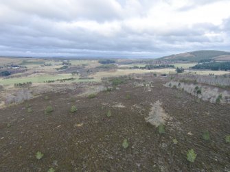 Oblique aerial view of hut circles A and B, looking NE.