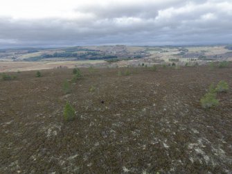 Oblique aerial view of hut-circles C, J and K, looking NW.