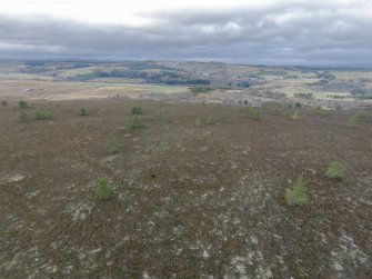 Oblique aerial view of hut-circles C, J and K, looking NW.