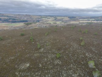 Oblique aerial view of hut-circles C, J and K, looking NE.