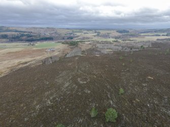 Oblique aerial view of hut circle E looking NW.