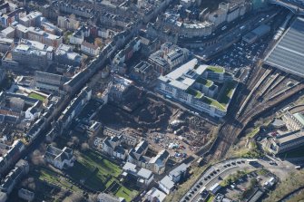 Oblique aerial view of the Caltongate Development and Waverley Court, looking WSW.