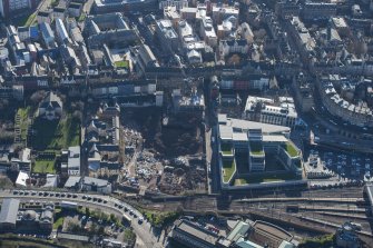 Oblique aerial view of the Caltongate Development and Waverley Court, looking SSE.