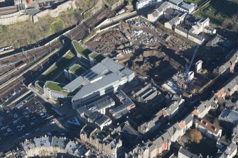 Oblique aerial view of the Caltongate Development and Waverley Court, looking NNE.