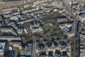 Oblique aerial view of Greyfriars Church, George Heriot's School and Royal Infirmary, looking N.