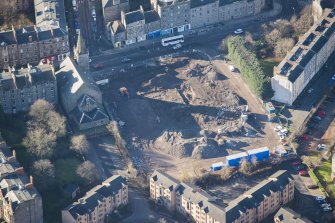 Oblique aerial view of the construction of Student flats in St Leonard's Street and the Roman Catholic Church of St Margaret and St Leonard, looking SW.
