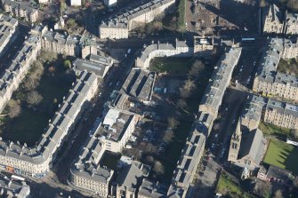 Oblique aerial view of the construction of student flats on the site of the former printing works and John Sinclair House, looking NE.