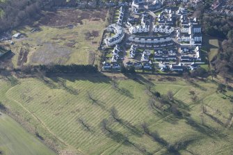 Oblique aerial view of Dunfermline College of Physical Education and rig and furrow, looking SW.