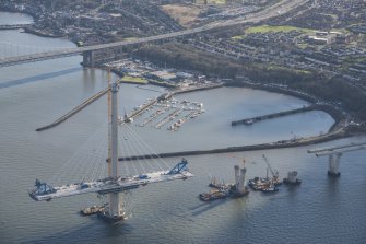Oblique aerial view of the south tower of the Queensferry Crossing and Port Edgar, looking ESE.