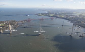 Oblique aerial view of the Forth Road Bridge, Forth Bridge and Queensferry Crossing, looking E.