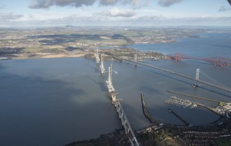 Oblique aerial view of the Forth Road Bridge, Forth Bridge and Queensferry Crossing, looking NE.