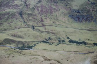 Oblique aerial view of field boundaries, rig and furrow, and tracks at Glen Eagles, looking W.