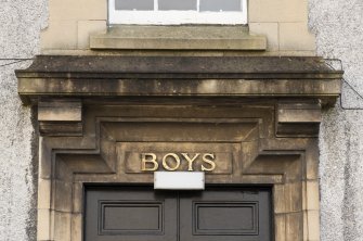 Detail of 'boys' inscription abover former entrance.
