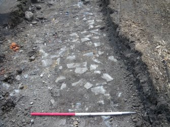 View of part of cobbled surface, photograph from final report on an archaeological evaluation at Main Street, Bridgeton