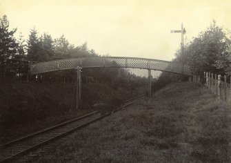 View of footbridge across railway line, Peebles Hydro