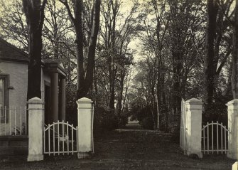 View from SE of entrance gates and avenue, the Peel, Busby
