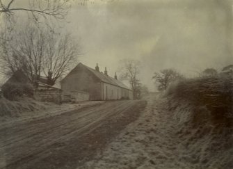 General view of cottages and snow-covered ground, possibly near The Peel, Busby
