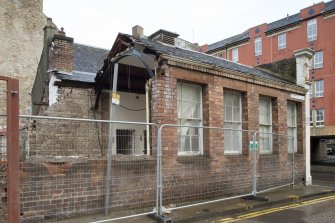 View of partially demolised building at Buccleuch Street from South West.