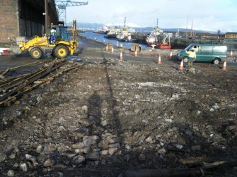 View of area cleared of cobbles (facing E), during archaeological monitoring at James Warr Dock, Greenock