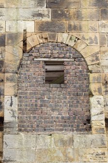 West elevation. Detail of partially blocked opening. The beam of the pumping engine would have protruded here.