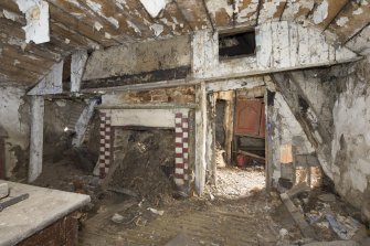 Living room, view from south showing fireplace.