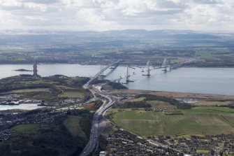 Oblique aerial view of the Forth Bridge, the Forth Road Bridge and the construction of the Queensferry Crossing, lookingSE.
