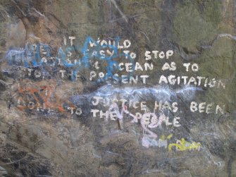 Detail view of quote painted on 'Pongo' boulder.