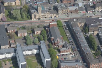 Oblique aerial view of St Columbkille's Roman Catholic Church and Rutherglen Town Hall, looking N.