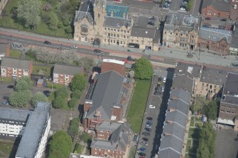 Oblique aerial view of St Columbkille's Roman Catholic Church and Rutherglen Town Hall, looking NNW.
