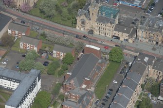 Oblique aerial view of St Columbkille's Roman Catholic Church and Rutherglen Town Hall, looking NE.