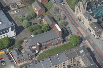 Oblique aerial view of St Columbkille's Roman Catholic Church and Rutherglen Town Hall, looking WNW.