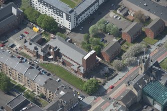 Oblique aerial view of St Columbkille's Roman Catholic Church and Rutherglen Town Hall, looking SW.