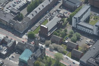 Oblique aerial view of St Columbkille's Roman Catholic Church and Rutherglen Town Hall, looking SSE.