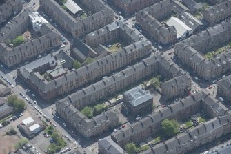 Oblique aerial view of Holy Cross School, Govanhill Public School, Govanhill Public School, Allison Street and Daisy Street, looking NNW.