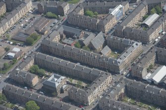 Oblique aerial view of Holy Cross School, Govanhill Public School, Govanhill Public School, Allison Street and Daisy Street, looking NNW.