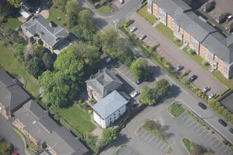 Oblique aerial view of 23, 25 and 25A Mansionhouse Road, looking SW.