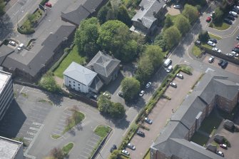 Oblique aerial view of 23, 25 and 25A Mansionhouse Road, looking S.