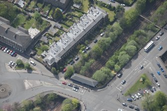 Oblique aerial view of 36 Ibrox Terrace, Strathbungo Station and Moray Place, looking SW.
