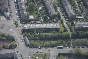 Oblique aerial view of 36 Ibrox Terrace, Strathbungo Station and Moray Place, looking SE.