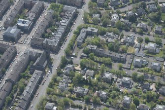 Oblique aerial view of Pollokshields Parish Church, The Knowe villa and lodge, looking S.