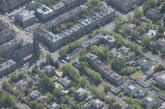 Oblique aerial view of Pollokshields Parish Church, The Knowe villa and lodge, looking SE.