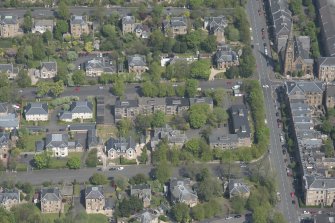 Oblique aerial view of Pollokshields Parish Church, The Knowe villa and lodge, looking NNE.