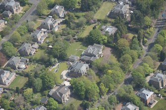 Oblique aerial view of Castlehill and Ellisland villas, looking ENE.