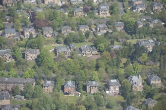 Oblique aerial view of Castlehill and Ellisland villas, looking N.